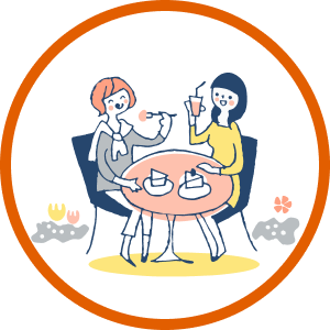 カフェで女性二人が食事を楽しんでいるイラスト